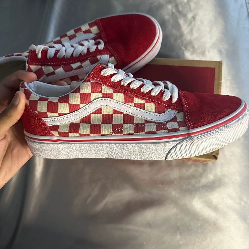 Red and white checkered board vans.